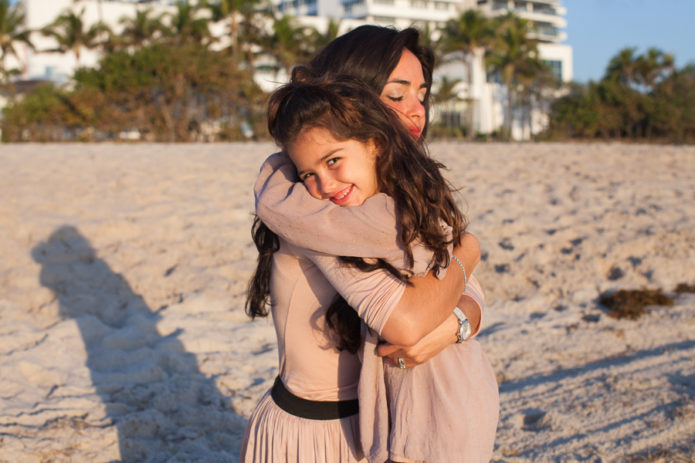 mother daughter hug miami