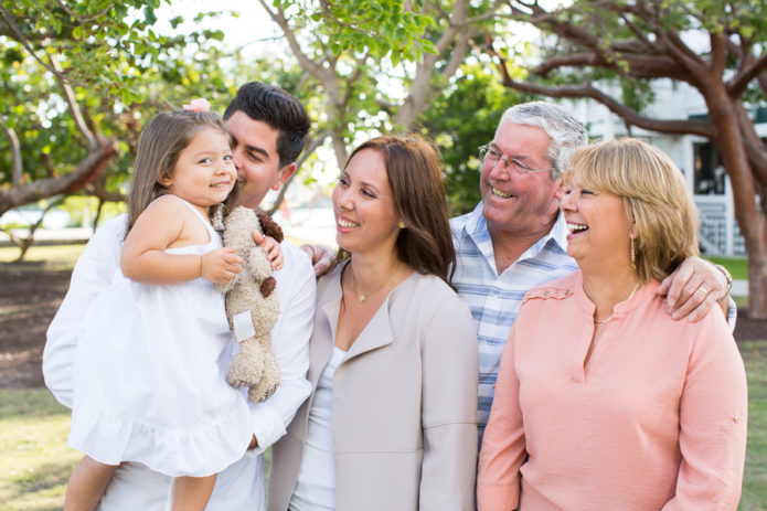 Grandparents and parents looking at daughter and granddaughter Miami Beach