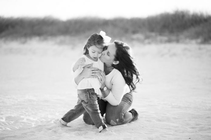 Mother kissing daughter Miami Beach