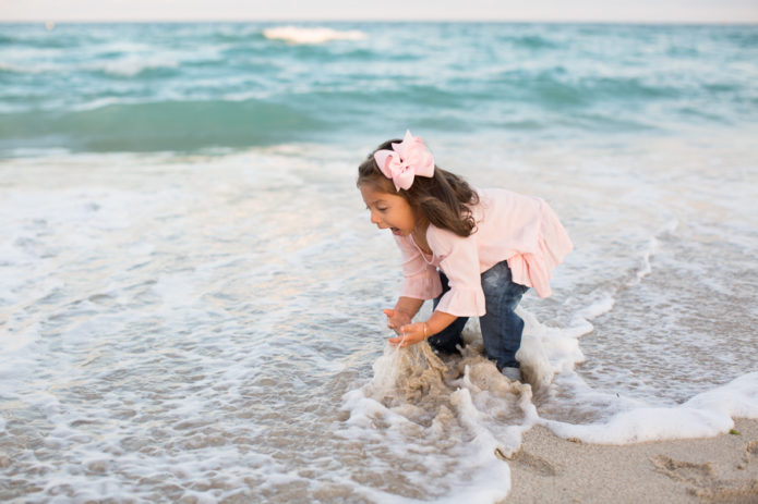 Girl playing in Miami Beach ocean