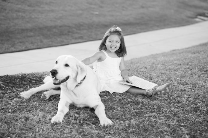 Girl petting dog Miami Beach