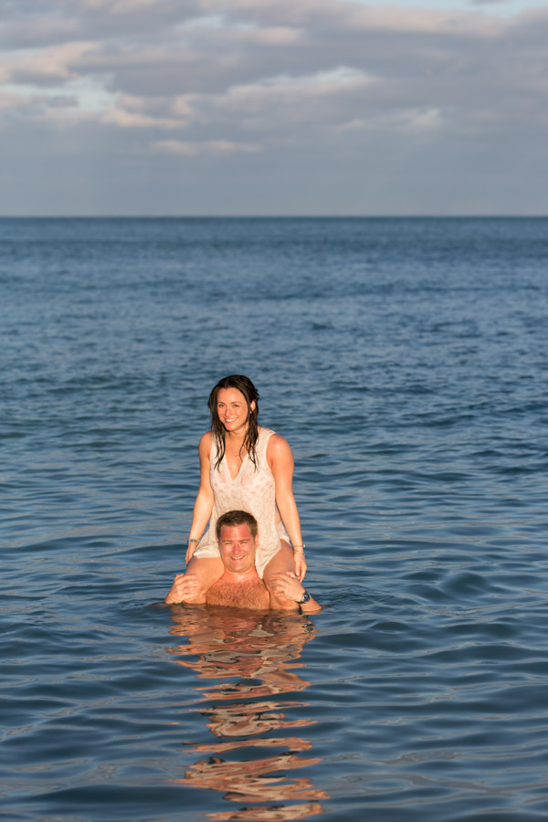 couple in water engagement photos