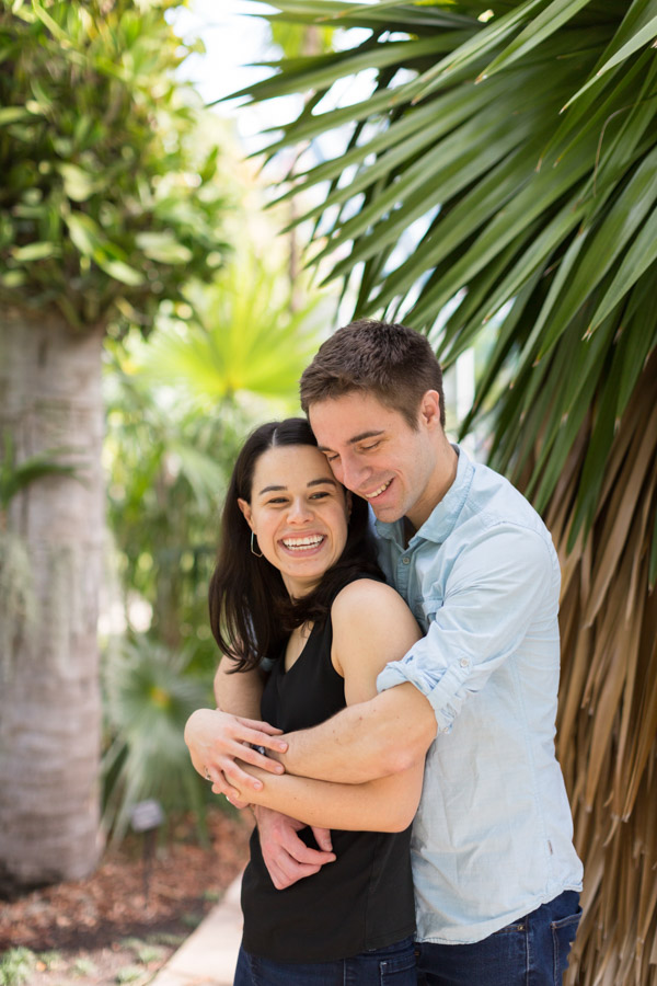 Premium Photo | Portrait of young happy couple in love smiling and  embracing in garden sweet lovers wearing in stylish dark sunglasses and  casual clothes posing and looking at camera at daytime