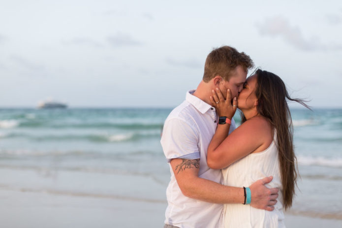 couple kissing on beach