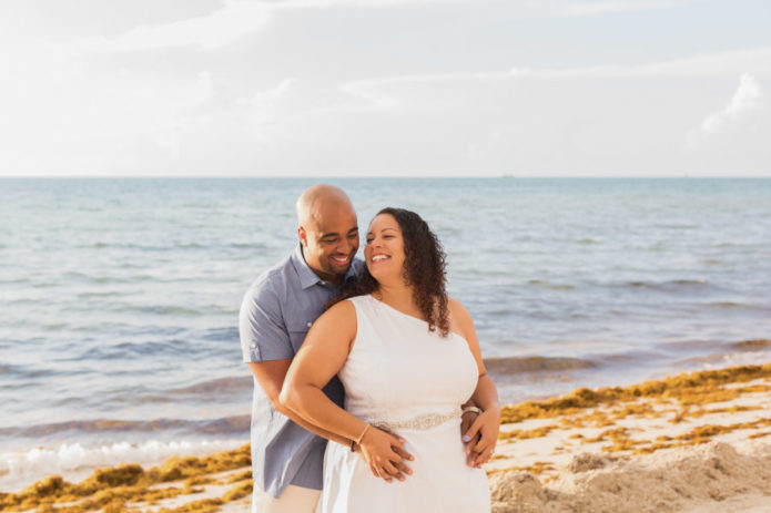 couple looking at each other on beach