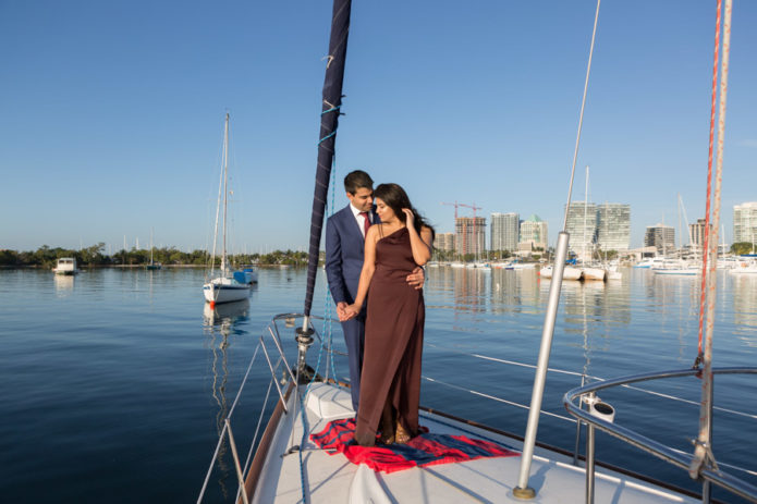 couple engagement on boat in coconut grove