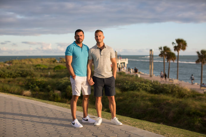 couple holding hands at south pointe park