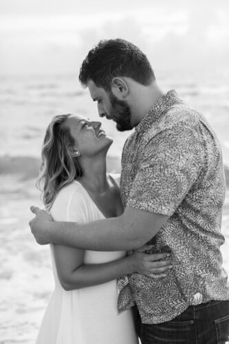 couple engagement black and white beach portrait