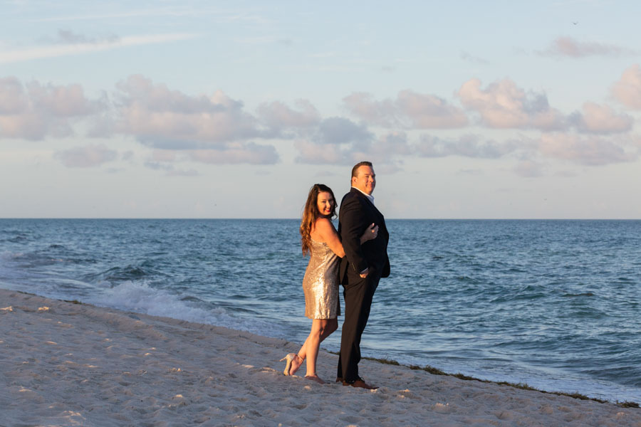 couple pose miami beach sunset golden glow