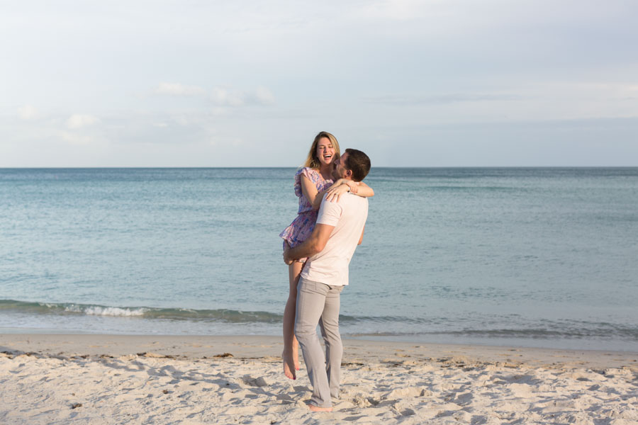 man lifts fiancé miami beach
