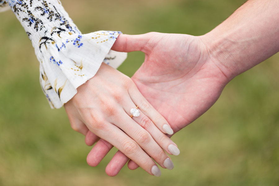 couple hands engagementn ring