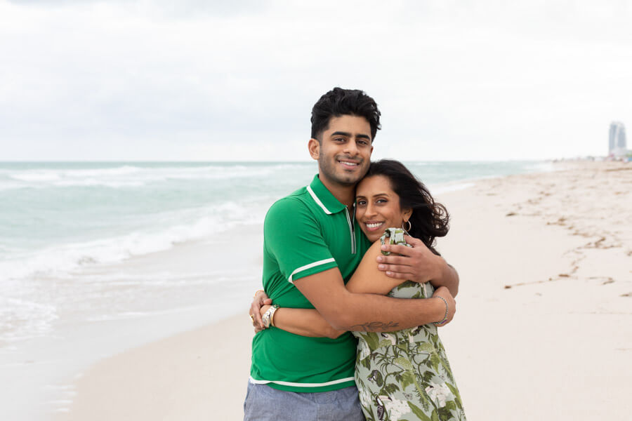 mother hugging adult son miami beach