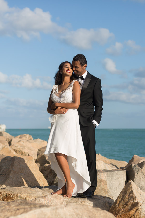Happy young couple wearing white dress on the beach on holidays, travel,  romantic, wedding concept 11045925 Stock Photo at Vecteezy