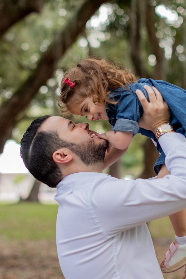 father holding daughter