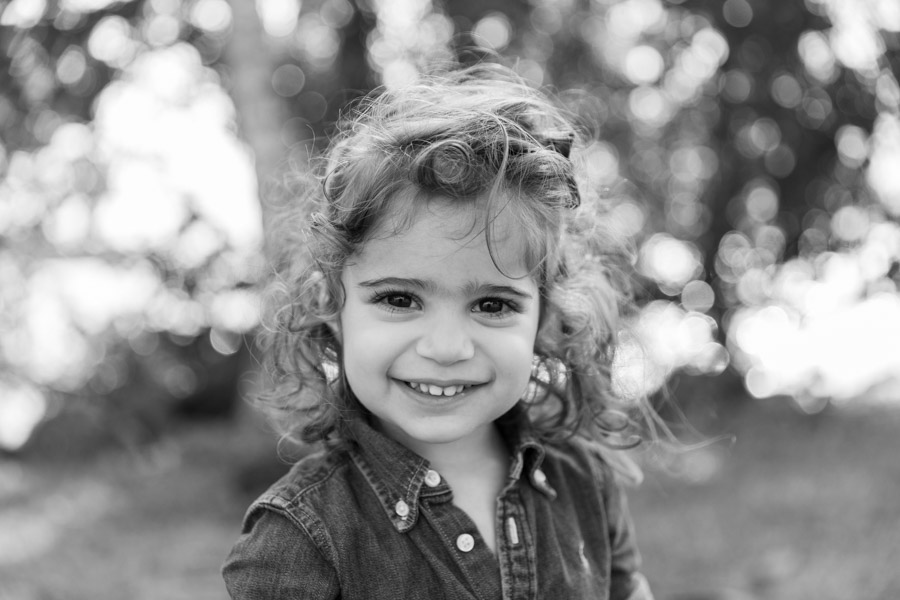 black and white portrait of girl smiling