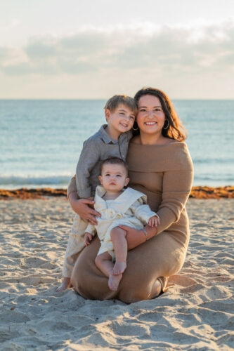 mother with two kids on beach