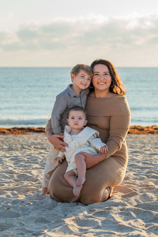 mother with two kids on beach