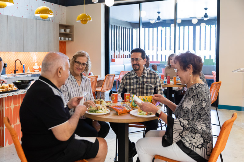 Members sharing a meal together at Senior Planet Miami